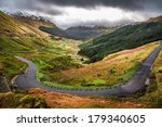 winding mountain road over a...