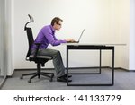  - stock-photo-bad-sitting-posture-at-laptop-short-sighted-business-man-on-chair-in-his-office-141133729