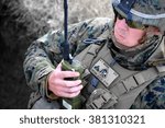 Small photo of GALATI, ROMANIA - OCTOBER 8: US soldier requesting air support in Romanian military polygon in the exercise Smardan Danube Express 14 on Galati, Romania, 8 october 2014.