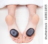 Small photo of Hot stone reflexology feet massage