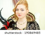Small photo of Portrait of young red-haired royal personage