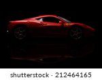 stock-photo-krivoy-rog-ukraine-aug-toy-ferrari-italia-on-black-background-friday-august-212464165.jpg