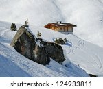 a mountain wooden hut covered...