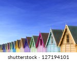row of beach huts with a deep...