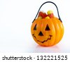 Halloween treat bag filled with candy corn candies on white background. - stock photo