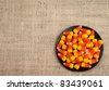A Bird's Eye View of Candy Corn in a Dish for Halloween or Thanksgiving Themed Invitation or Card with Area for Your Words - stock photo