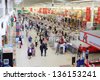 SAMARA - MAY 5: People make purchases in Auchan superstore, on May 5, 2012 in Samara, Russia. French distribution network Auchan unites more than 1300 shops. - stock photo