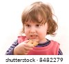 child eating cookies