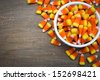 Classic white, orange and yellow candy corn sweets for Halloween with copy space. - stock photo
