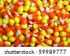 Yellow orange and white candy corn halloween candy - stock photo