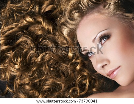 Beautiful woman with long curly hair