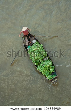 Trader on floating asia market