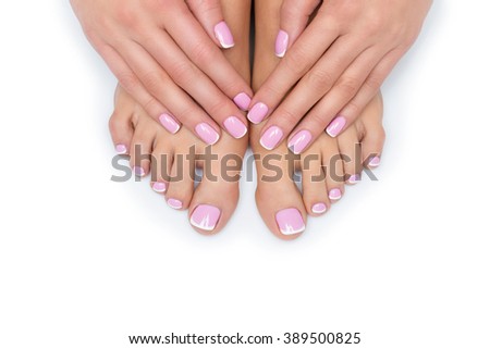 Woman hands and feet with french manicure