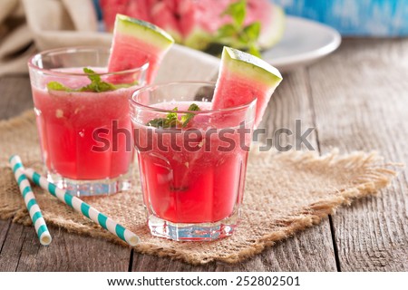 Watermelon drink in glasses with slices of watermelon - stock photo