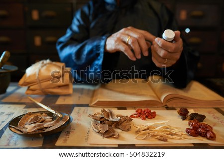 Hands of practitioner making remedy for his patient