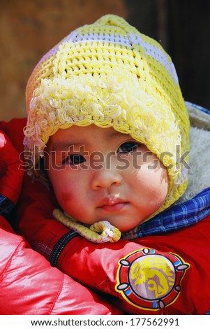 HA GIANG, VIETNAM - FEB 15: Unidentified kid Ethnic Minority People at Market on February 15, 2014 in Ha Giang , Vietnam.