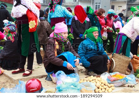 HAGIANG, VIETNAM, FEBRUARY 16: Unidentified ethnic minority women in a traditional market on February 16, 2014 in HaGiang, Vietnam. Ha Giang is a northernmost province in Vietnam