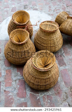 Weaving bamboo fish trap in HungYen, Vietnam. Weaving this tools that used to catch fish is traditional occupation in Hung Yen province.