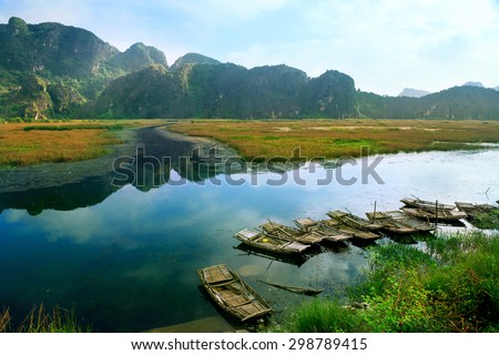 Landscape with boat in Van Long natural reserve in Ninh Binh, Vietnam