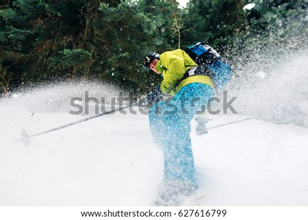 stock-photo-man-with-special-ski-equipment-is-riding-fast-jumping-freeriding-very-fast-in-the-mountain-forest-627616799.jpg