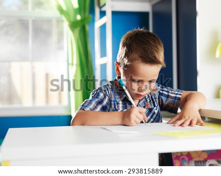 cute little boy learning alphabet