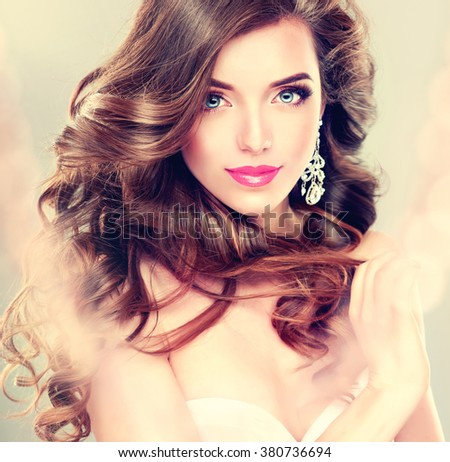 https://thumb7.shutterstock.com/display_pic_with_logo/1054231/380736694/stock-photo-beautiful-model-brunette-with-long-curled-hair-and-jewelry-earrings-380736694.jpg