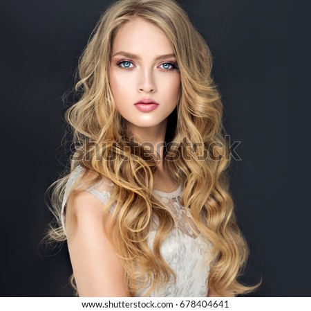https://thumb7.shutterstock.com/display_pic_with_logo/1054231/678404641/stock-photo-blonde-fashion-girl-with-long-and-shiny-curly-hair-beautiful-model-in-light-blue-dress-678404641.jpg