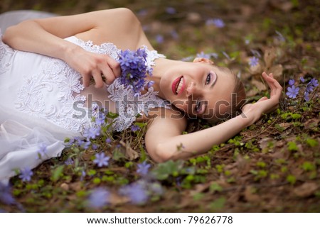 https://thumb7.shutterstock.com/display_pic_with_logo/10550/10550,1308637563,1/stock-photo-beautiful-bride-with-small-purle-anemone-bouqet-79626778.jpg