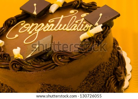 https://thumb7.shutterstock.com/display_pic_with_logo/1059122/130726055/stock-photo-gourmet-chocolate-cake-decorated-for-graduation-party-130726055.jpg