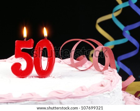Birthday-anniversary cake with red candle showing Nr. 50 - stock photo