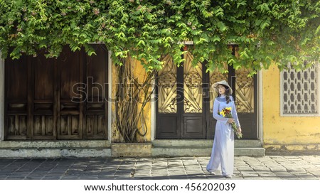 Portrait of Vietnamese girl traditional dress, Ao dai is famous traditional costume for woman in Vietnam