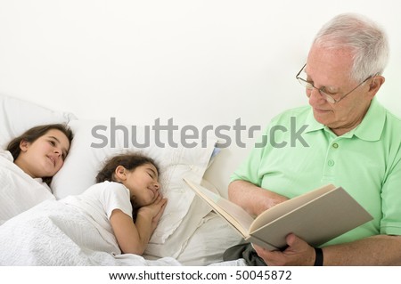 stock-photo-grandfather-reading-to-grandchild-a-bed-time-story-50045872.jpg