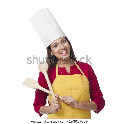 https://thumb7.shutterstock.com/display_pic_with_logo/1104728/163059089/stock-photo-portrait-of-a-happy-woman-holding-a-spatula-and-ladle-163059089.jpg