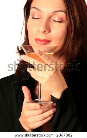 good looking woman enjoying a cup of fine wine