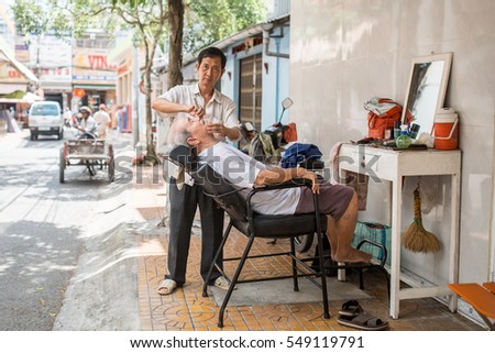 Soc Trang, Vietnam - November 13, 2016: Local barber in Chinatown area in Soc Trang, November 13, 2016, Vietnam.