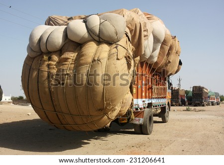 stock photo rajasthan india circa heavily overloaded truck carrying cotton crop kota rajasthan india 231206641