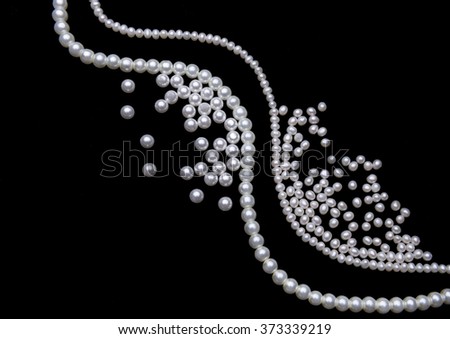 beautiful pearls on black background