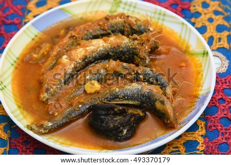 sardine fish cooked. Traditional hot and spicy fish curry Kerala India with dried red chilly.. Very popular coastal food eat with with tapioca or rice.