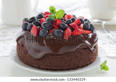 Chocolate cake with summer berries. - stock photo