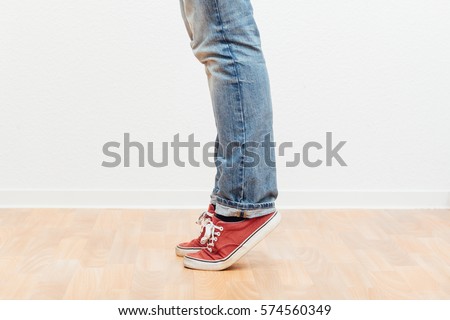 Man legs walking towards camera, casual clothing with jeans and shoes ...