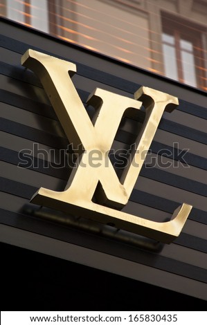 Florence, ITALY - December 8, 2011: Louis Vuitton Florence Store Logo Italy mounted on the marble wall of Louis Vuitton Store at Via de' Tornabuoni, the heart of Florence high-class shopping district
