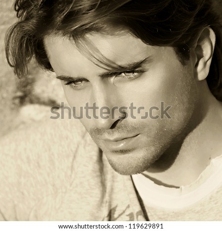 sepia toned portrait of handsome man