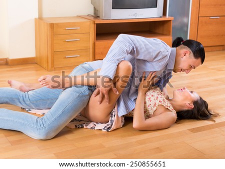 Having sex on the floor