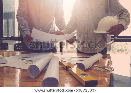Architect concept, Architects working with blueprints in the office, Vintage Effect