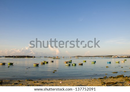 Early morning on the beach with traditional boats in Ninh Thuan, Vietnam