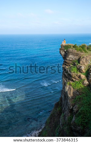 Young man in the top of the rock in Ly Son, Quang Ngai, Vietnam.