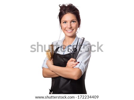 Attractive hairdresser woman with professional tools in her hands. Isolated on white.