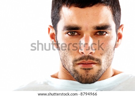 fashion male portrait with a very agressive and intense stare - isolated over a white background
