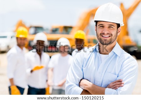 Successful male architect at a building site with arms crossed