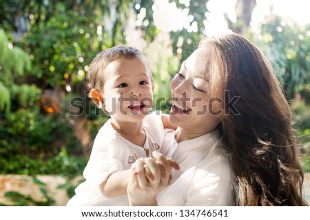 Attractive mixed female lifestyle spending time with happy child